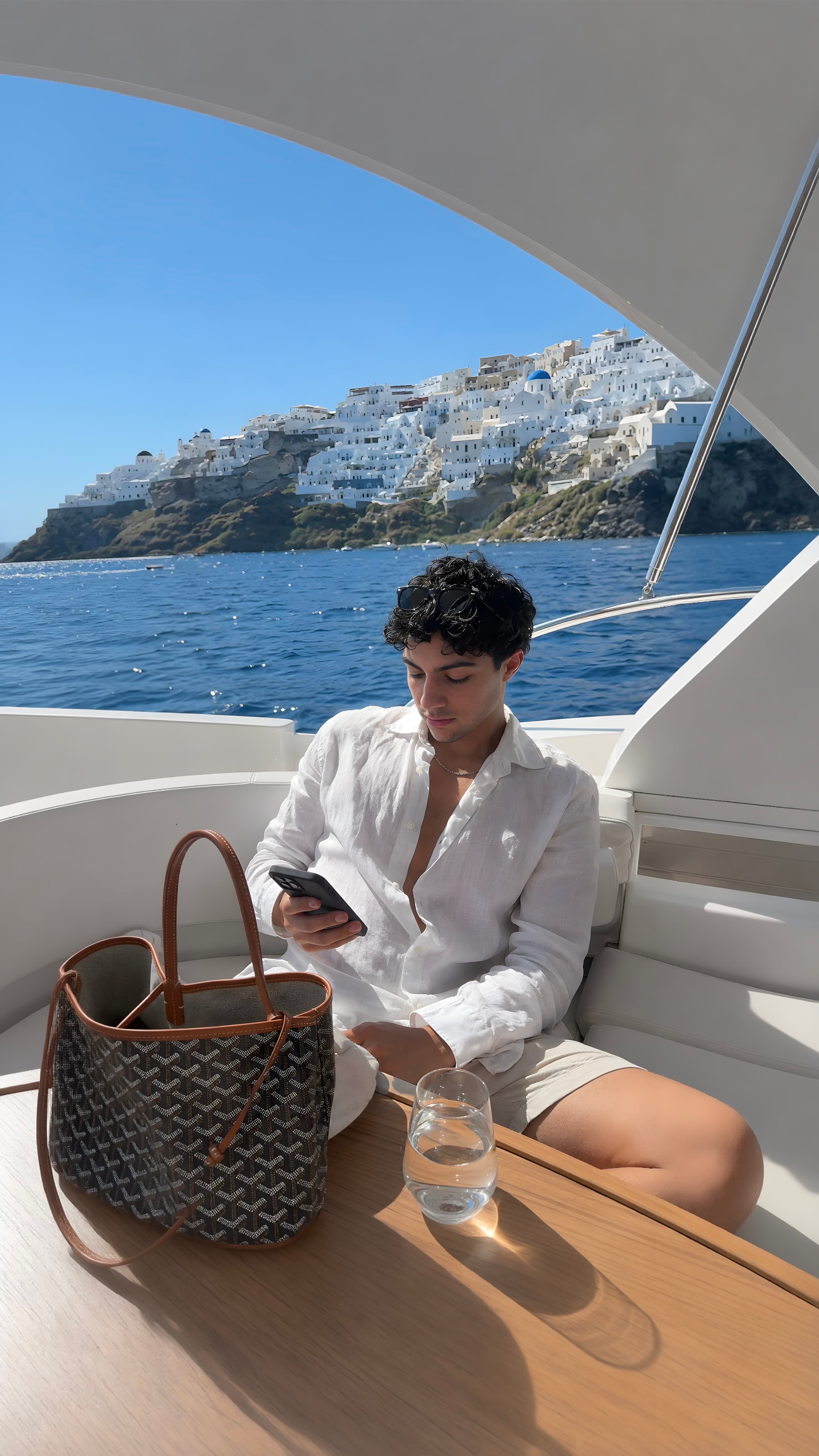 The same yacht deck photo after the Quality Method: sharper detail, visible skin texture, and a wider reframed composition.